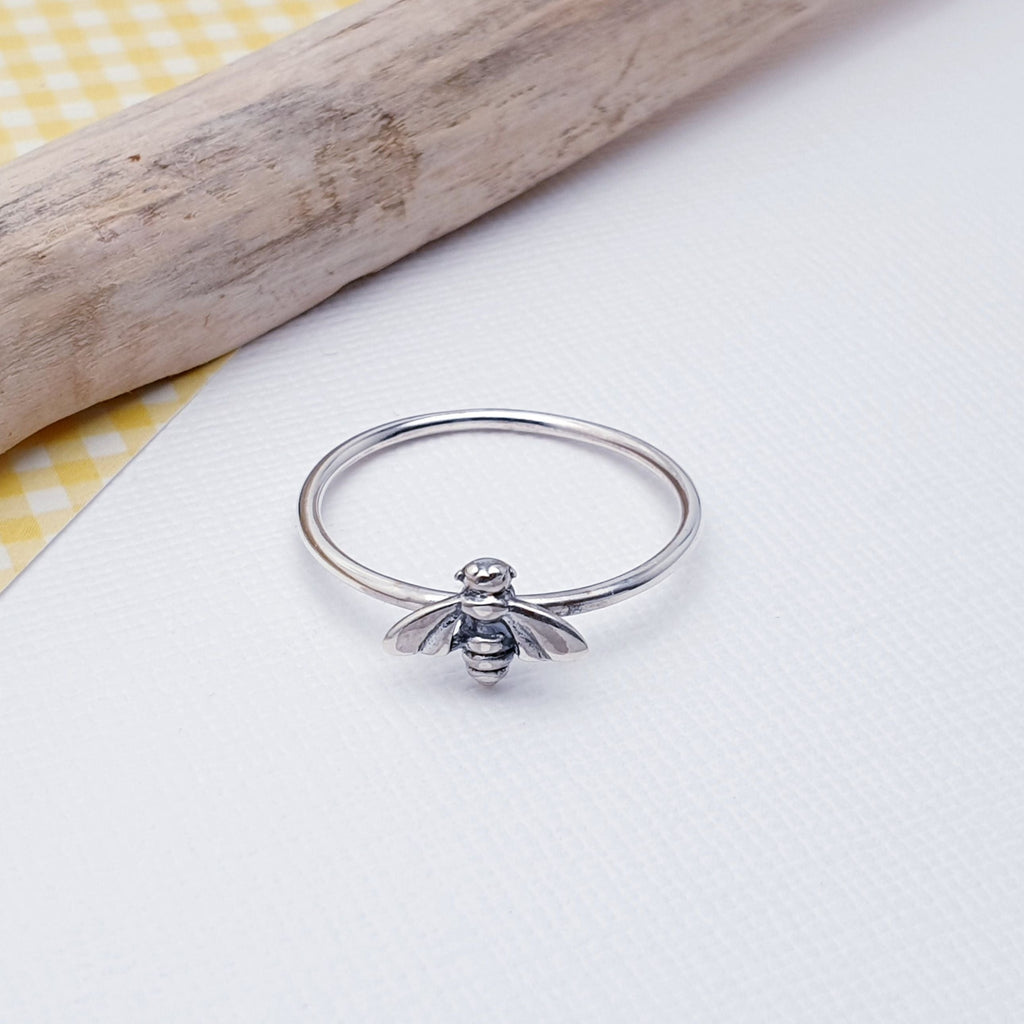 Our Sterling Silver Honey Bee Ring is perfect for everyday wear or special occasions.  A sweet touch of style, this delicate Sterling Silver Honey Bee Ring is perfect for when you want to add a unique and cute detail to your look. Crafted with care and precision, it makes a charming addition to any outfit.