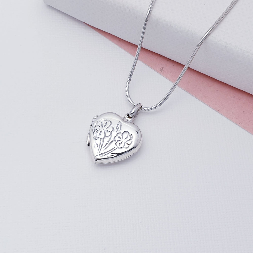 Our Sterling Silver Floral Heart Locket (chain not included) is perfect for everyday wear or special occasions, a beautiful finishing touch to any outfit.   This gorgeous Sterling Silver Floral Heart Locket is sure to add a romantic touch to any outfit. With its engraved floral detail, it's sure to be a special keepsake.