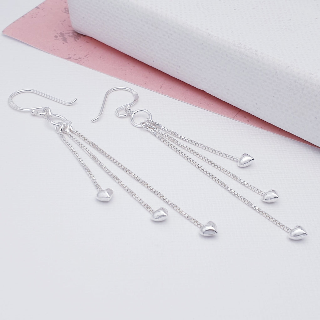 Our Sterling Silver Long Tassel Hearts Earrings are perfect for everyday wear or special occasions.  Their soft, flowing chains give these earrings a graceful, gentle movement catching the light and bringing a touch of elegance to any outfit. Dainty silver hearts decorate the bottom of each chain creating a chic and eye catching design.