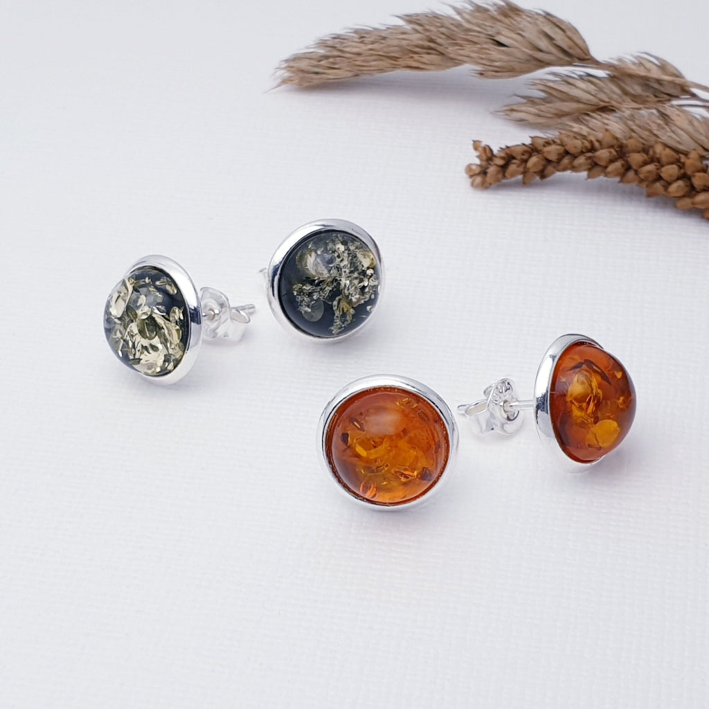 Our Toffee or Green Amber Sterling Silver Round Studs are perfect for everyday wear.  Add rich color and effortless style to your look with these beautiful amber sterling silver studs. Perfectly sized and set in a classic round design, these studs are sure to make a subtle yet stunning statement. Crafted with sterling silver and available in toffee or green amber, these earrings are the perfect touch of sophistication.