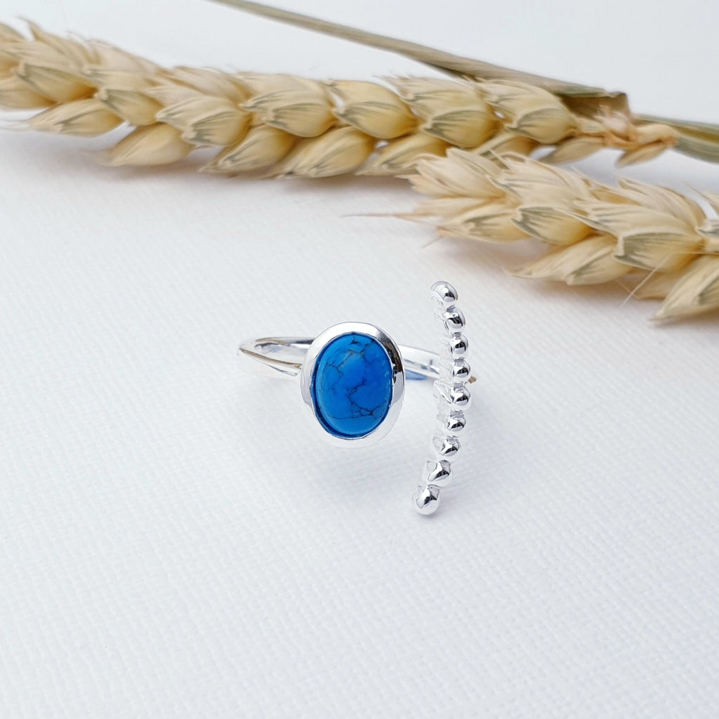 Our Turquoise Bubble Open Ring is perfect for everyday wear or special occasions.  This ring features a beautiful, cabochon, oval, Turquoise stone in a simple Sterling Silver setting. Open at the front, this ring wraps beautifully around the finger, with the Turquoise stone on one side