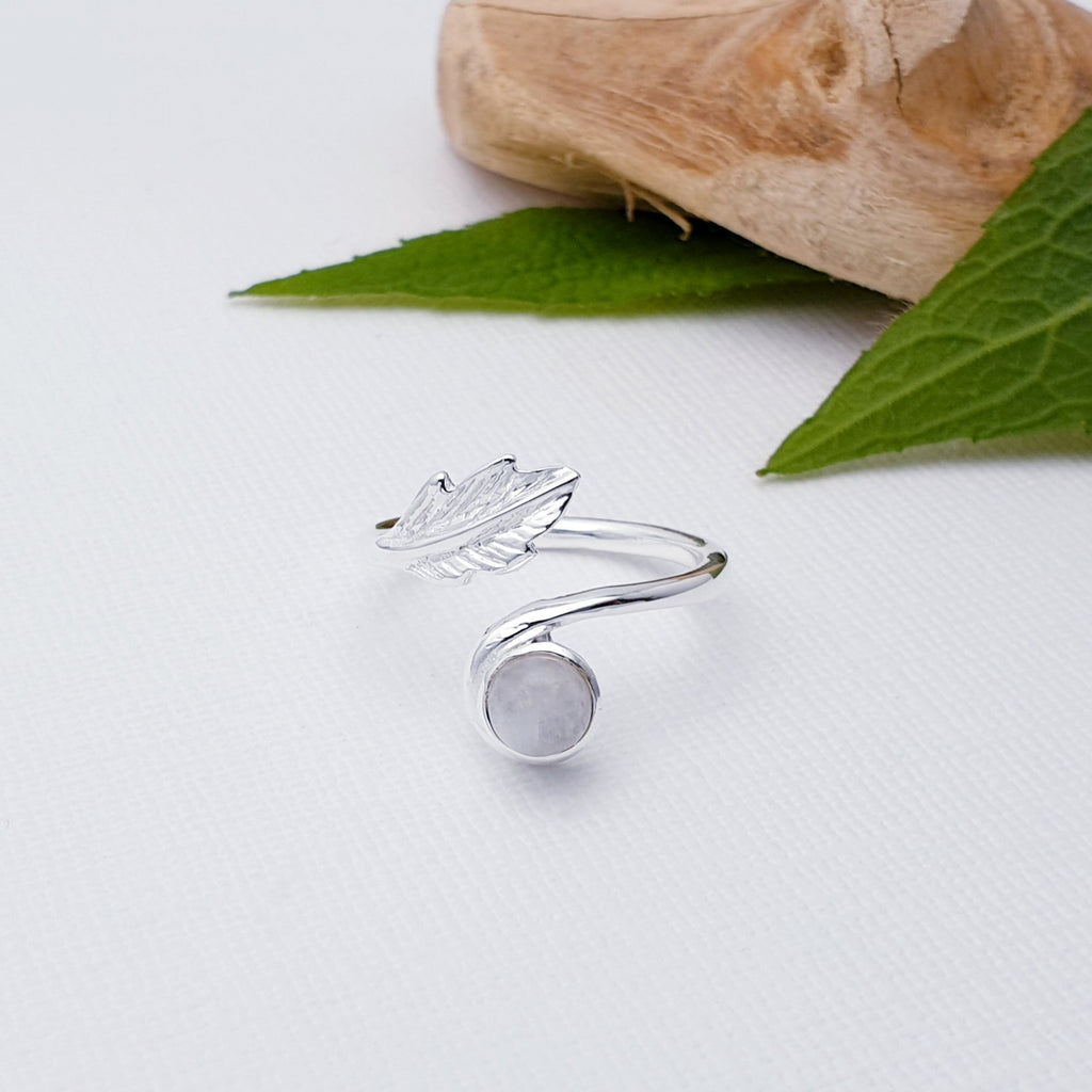 Our Moonstone Sterling Silver Leaf Ring is perfect for everyday wear or special occasions.  This elegant Moonstone Sterling Silver Leaf Ring is set with a beautiful round cabochon Moonstone stone and detailed with an intricate leaf design. Perfect for adding a hint of sparkle to your look.