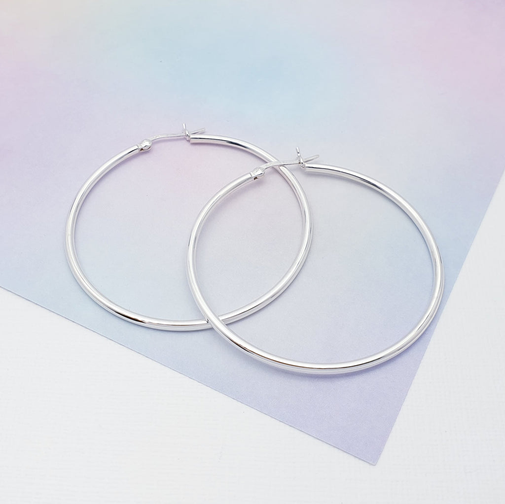 This design features a 5 cm diameter, 1.9 mm thick polished hoop earring.  Hinged Snap fastening means that they are extra secure so you won't have to worry about loosing them.