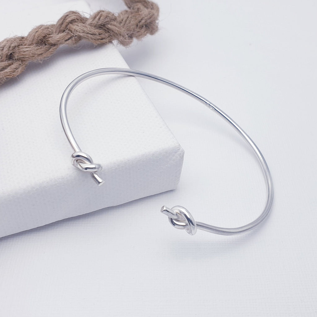 A beautiful design, this cuff bracelet features a fine Sterling Silver band with a simple knot at either end. Adjustable to most wrist sizes, this bracelet is light and easy to wear and is perfect as a gift for a loved one or as a little treat for yourself.