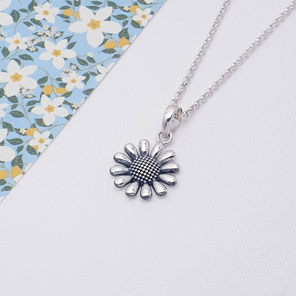 This pendant features a detailed Sterling Silver sunflower design. An oxidised finish gives the design depth and presence. This cute pendant is feminine, light and easy to wear. 