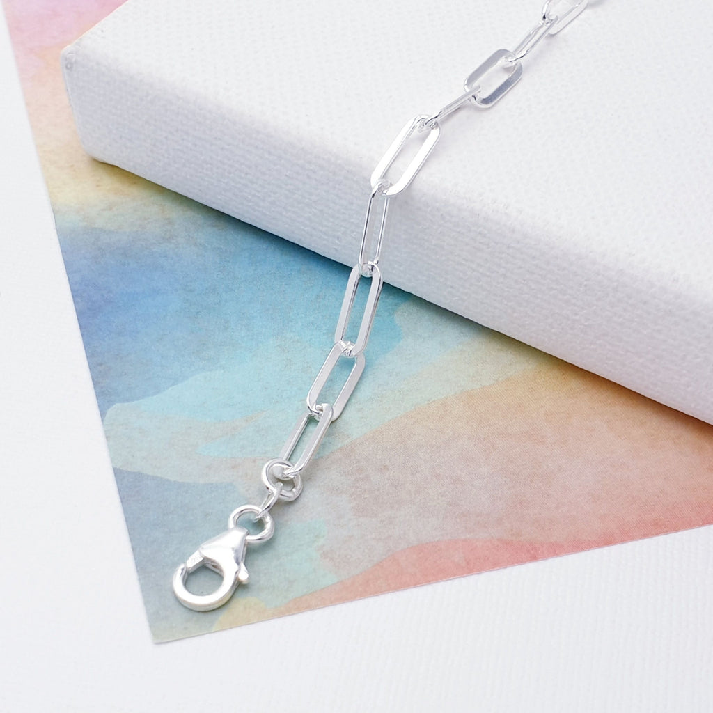 Our beautiful Sterling Silver Flat Paperclip Link Bracelet is perfect for everyday wear or special occasions.  This design features flat oval links that are connected in a paperclip pattern, creating beautiful fluidity and movement throughout the bracelet. 