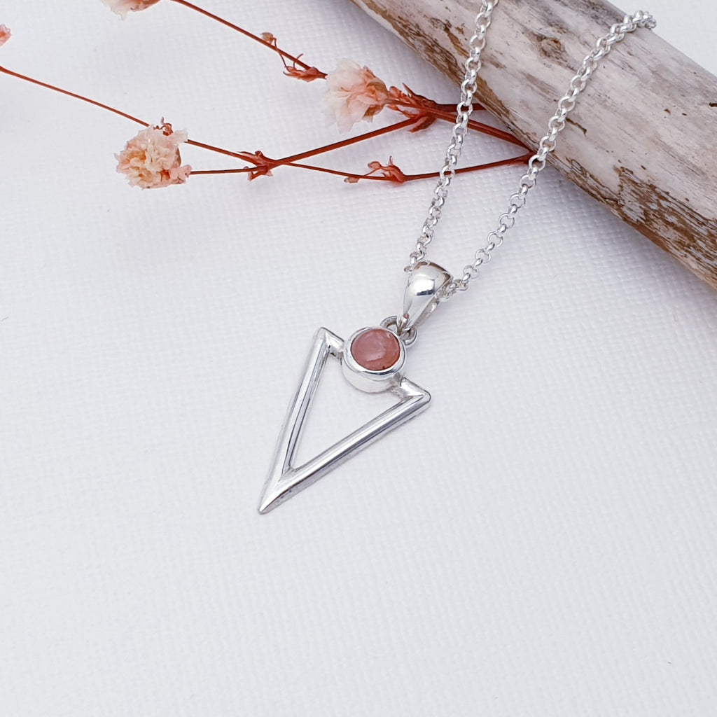This pendant features a beautiful Rhodochrosite set above a cut out, acute triangle design, hand worked in Sterling Silver. A fabulous geometric pendant, perfect worn on its own or layered with other necklaces creating your own unique look.