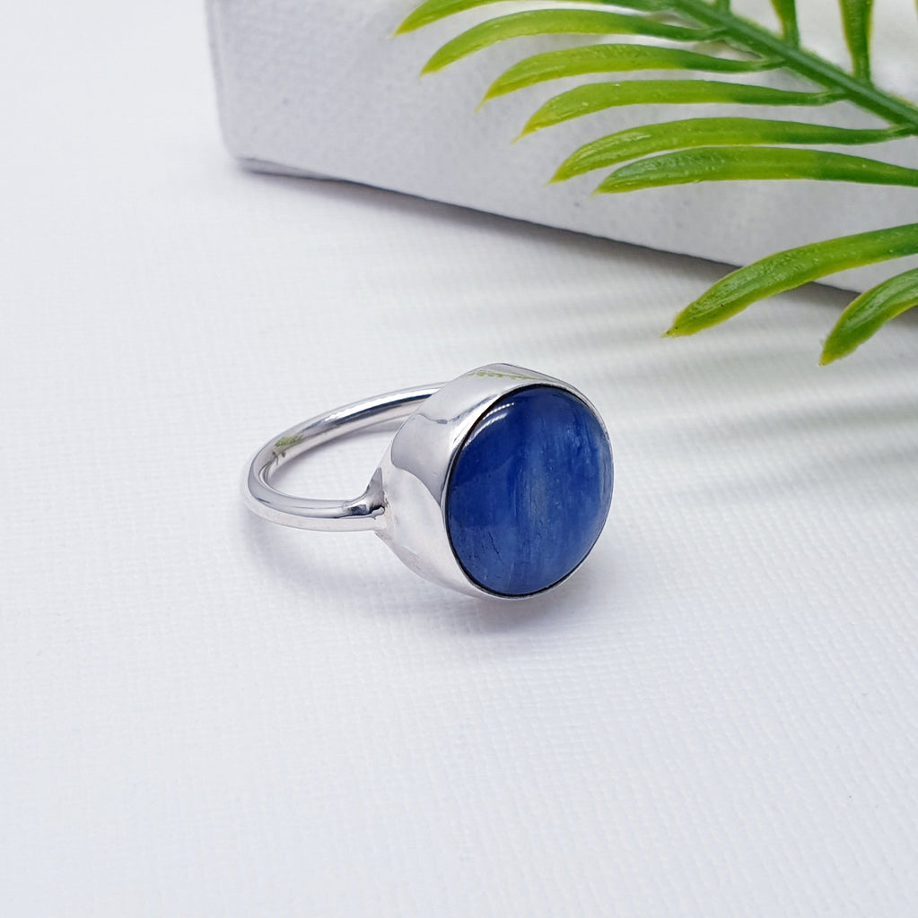 Our Kyanite Sterling Silver Round Ring is perfect for everyday wear or special occasions.  A beautiful simple design, this ring features a round cabochon, Kyanite stone in a simple setting on a sturdy band. This understated design will become your everyday favourite.