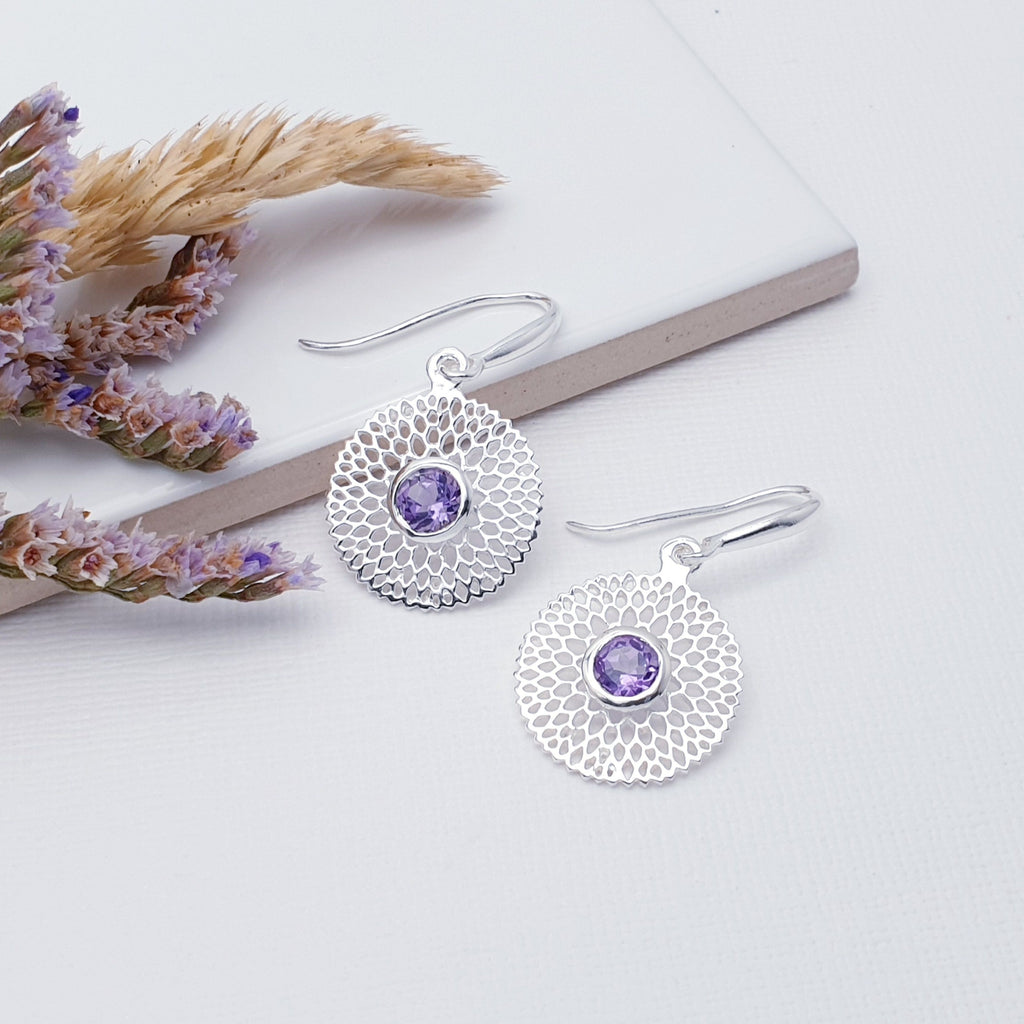 Our Amethyst Sterling Silver Chrysanthemum Earrings are perfect for everyday wear or special occasions.  These stunning earrings feature small, cabochon Moonstone's in the center of a beautifully detailed flower.