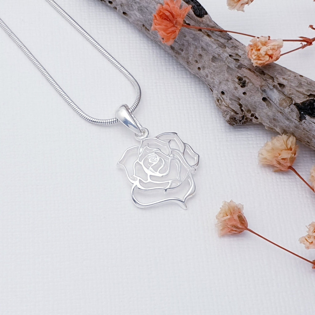 Our Sterling Silver Delicate Rose Pendant (chain not included) is perfect for everyday wear or special occasions.  This pendant features a detailed cut out rose design. A beautiful piece of jewelry that will add some sparkle and femininity to any outfit.