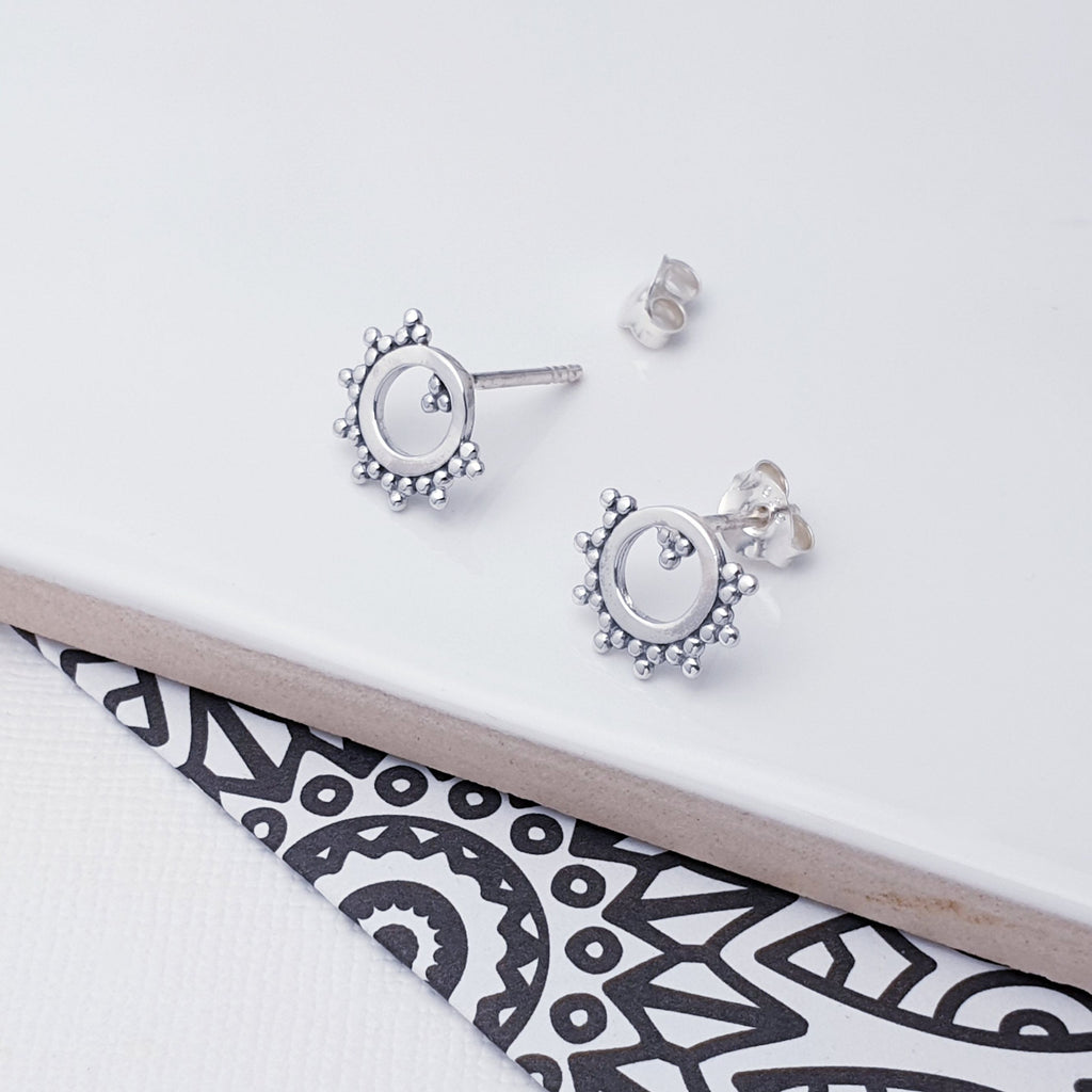 Our Sterling Silver Boho Circle Studs are perfect for everyday wear.  These studs feature an intricate boho circle design, enhanced by an oxidised finish. You'll love the subtle edge these studs bring to your style. Elevate your wardrobe with a small but impactful detail.