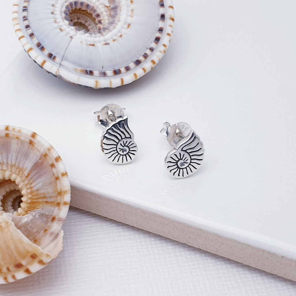 Our Sterling Silver Sea Shell Studs are perfect for everyday wear.  These intricately-designed Sterling Silver Sea Shell Studs will make the perfect addition to your summer look! The perfect gift for nature lovers, you just can't go wrong with this beautiful pair of stud earrings.