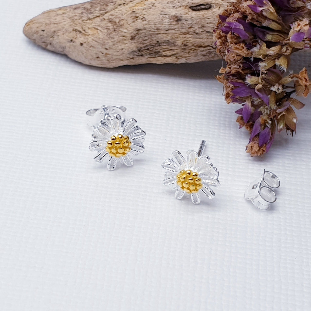 Our Sterling Silver and Gold Plated Daisy Studs are intricate, dainty, and perfect for everyday wear. No matter the occasion, these earrings will add just the right touch of elegance.  Daisies symbolise childbirth, motherhood and new beginnings, making these studs the perfect gift for a loved one and to congratulate new mothers.