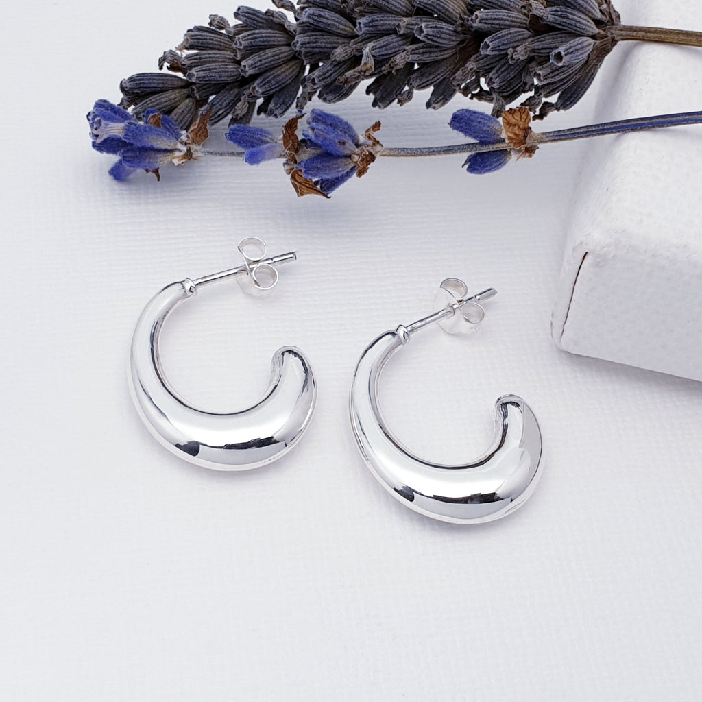 These simple dome design half hoops have a contemporary feel, are light on the ear and easy to wear. With a stud attachment, these hoops will feel extra secure while you get on with your day and are bound to become everyday favourites.