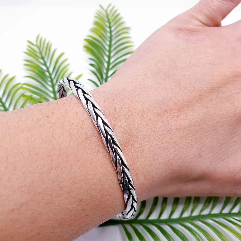 plaited sterling silver cuff on a wrist