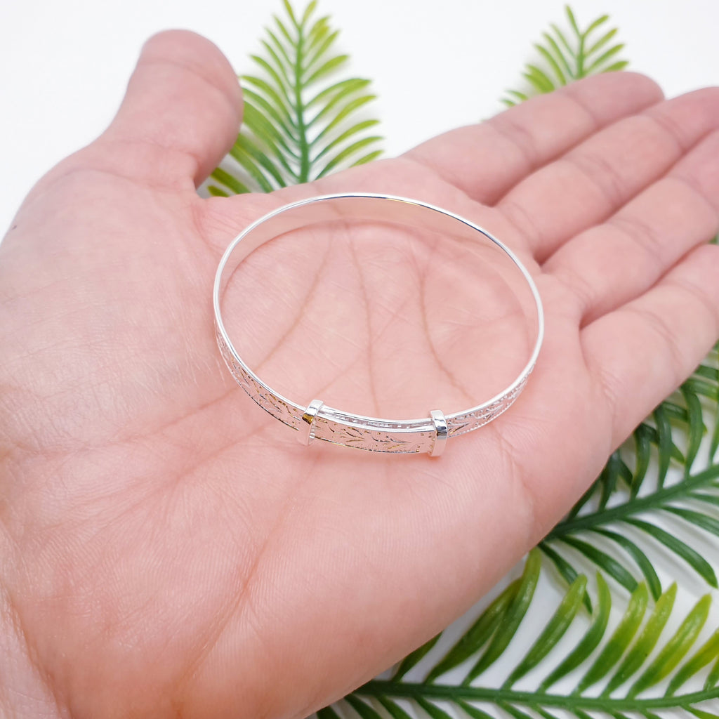 Sterling silver dainty child bangle with a love hearts design