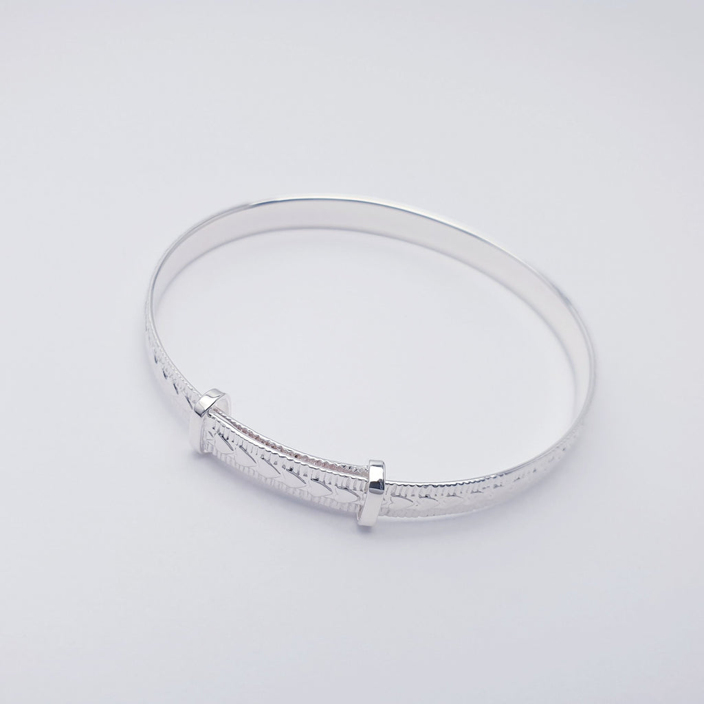 Sterling silver dainty child bangle with a love hearts design