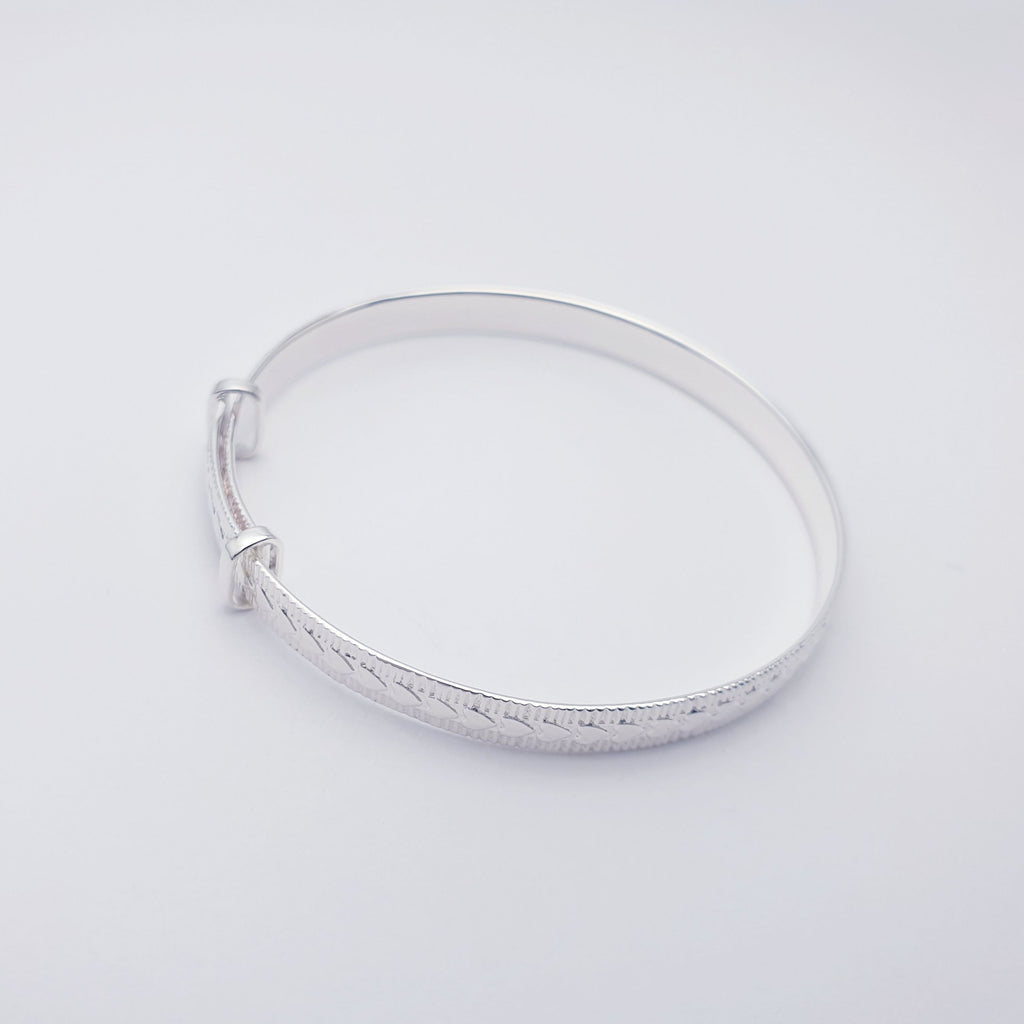 Sterling silver dainty child bangle with a love hearts design