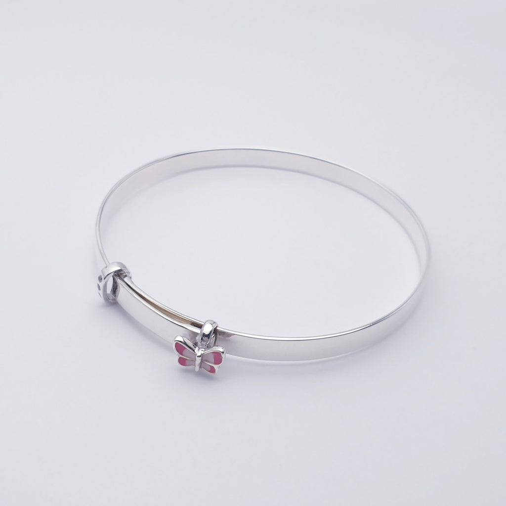 A beautiful, dainty bangle made in Sterling Silver. An extra special design with a tiny pink butterfly charm and 3 diamante diamonds. 