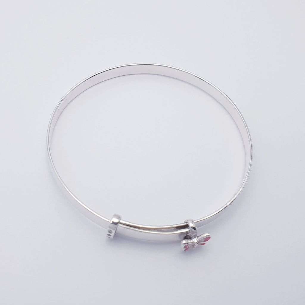 A beautiful, dainty bangle made in Sterling Silver. An extra special design with a tiny pink butterfly charm and 3 diamante diamonds. 