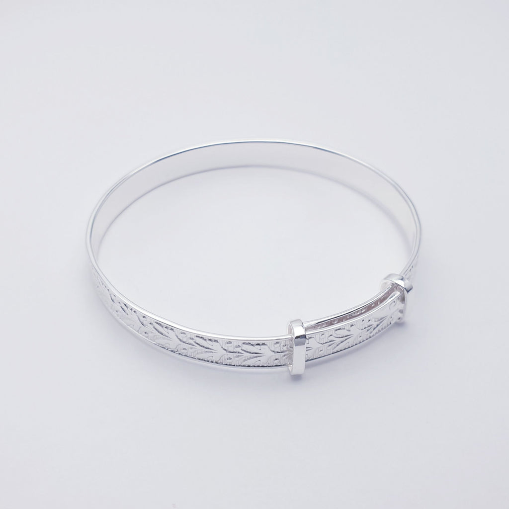 Our Sterling Silver Botanical Child Bangle is perfect for everyday wear or special occasions.