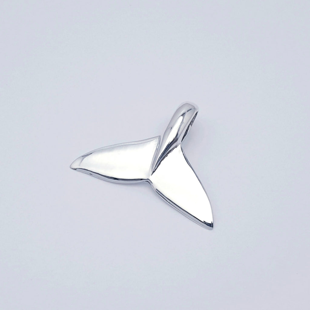 polished sterling silver whale tail fin pendant.