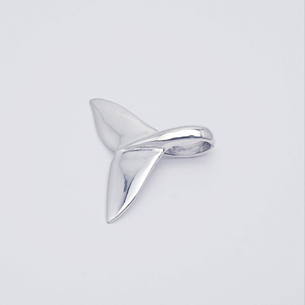 polished sterling silver whale tail fin pendant.