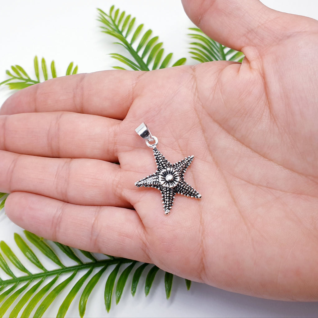 handmade oxidised sterling silver starfish pendant.