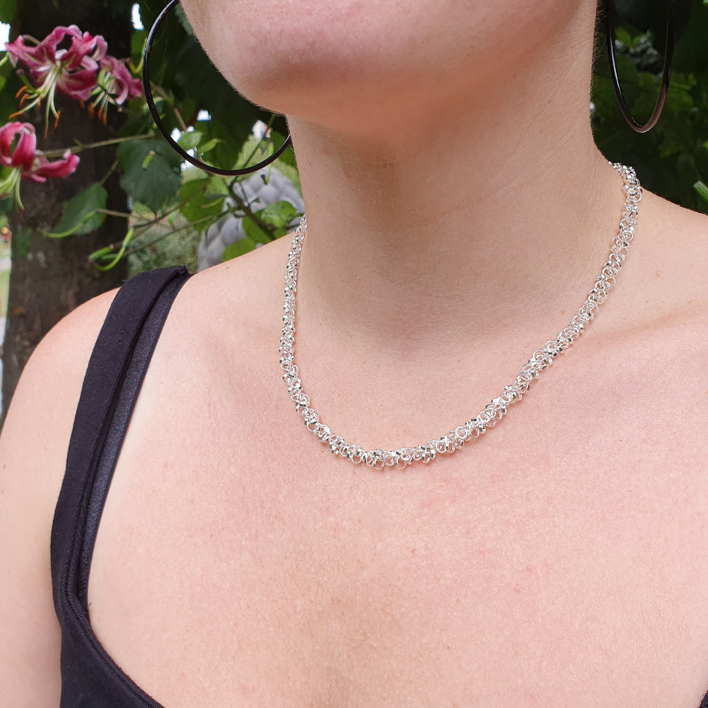 handmade, elegant sterling silver intertwined multi link chain necklace.