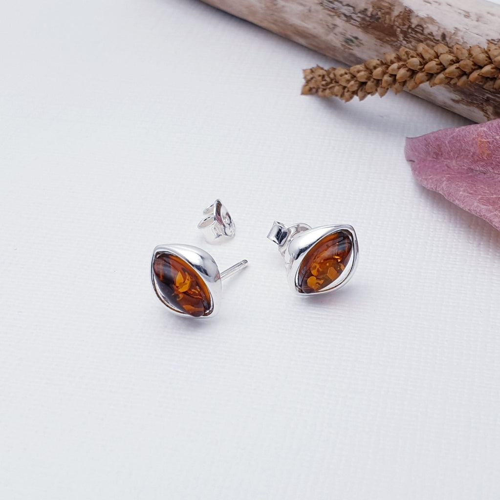 Our Toffee Amber Sterling Silver Seed Studs are perfect for everyday wear.  Add rich colour and effortless style to your look with these beautiful marquise Amber Sterling Silver studs. Perfectly sized and set in an eye-shaped design, these studs are sure to make a subtle yet stunning statement.