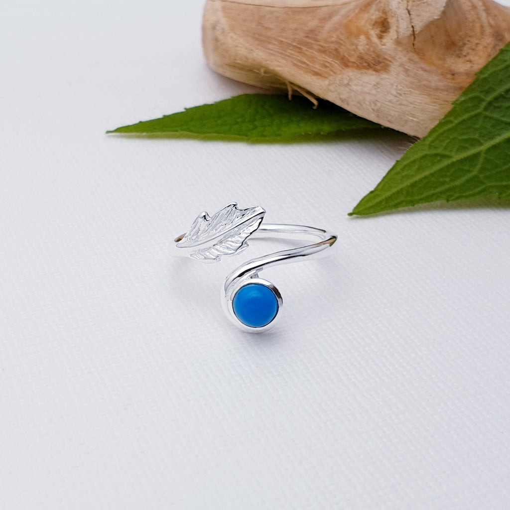 Our Turquoise Sterling Silver Leaf Ring is perfect for everyday wear or special occasions.  This elegant Turquoise Sterling Silver Leaf Ring is set with a beautiful round cabochon Turquoise stone and detailed with an intricate leaf design. Perfect for adding a hint of sparkle to your look.