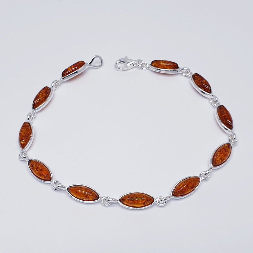 A Toffee Amber Sterling Silver Bracelet with marquise shaped stones. Dainty and elegant.