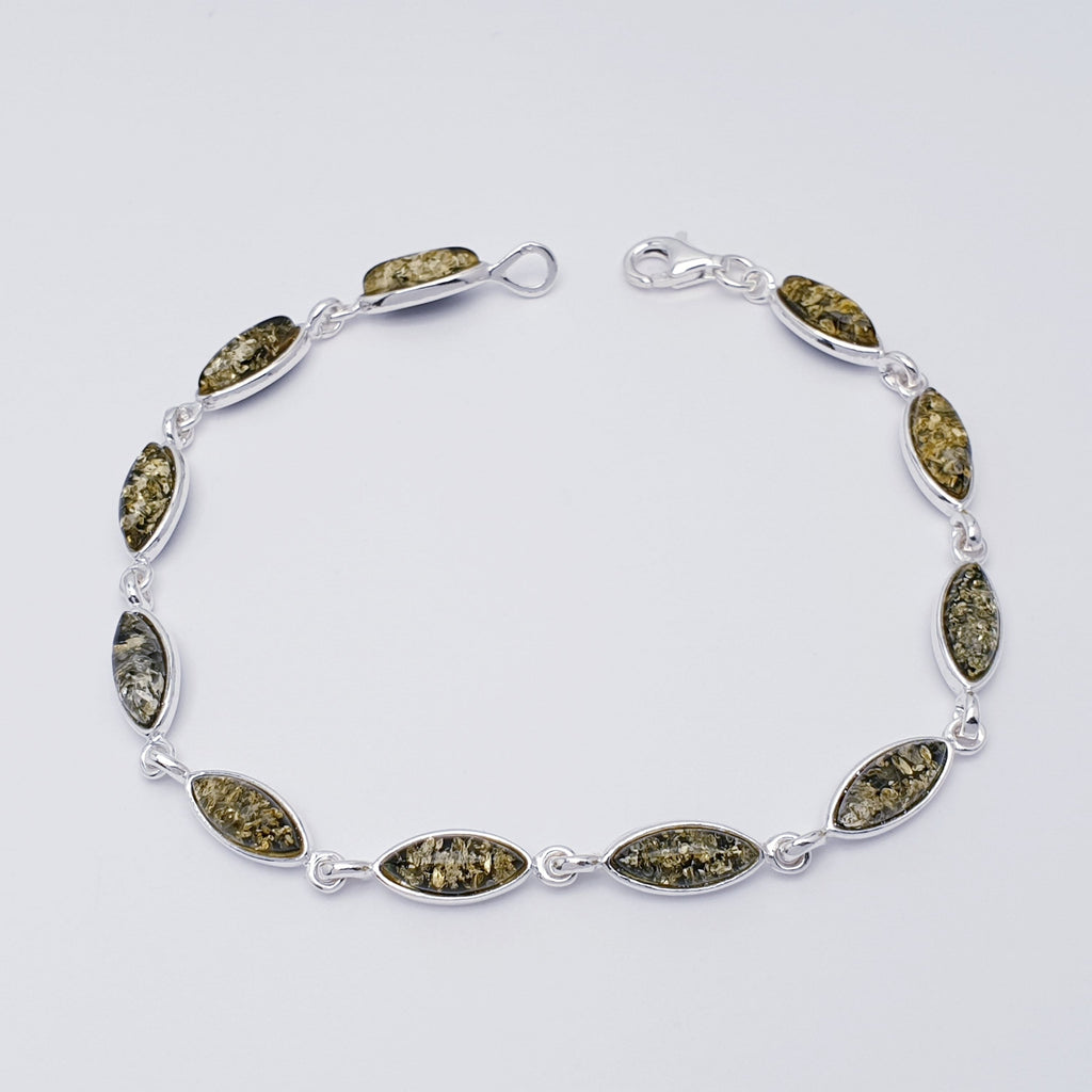 A Green Amber Sterling Silver Bracelet with marquise shaped stones. Dainty and elegant.