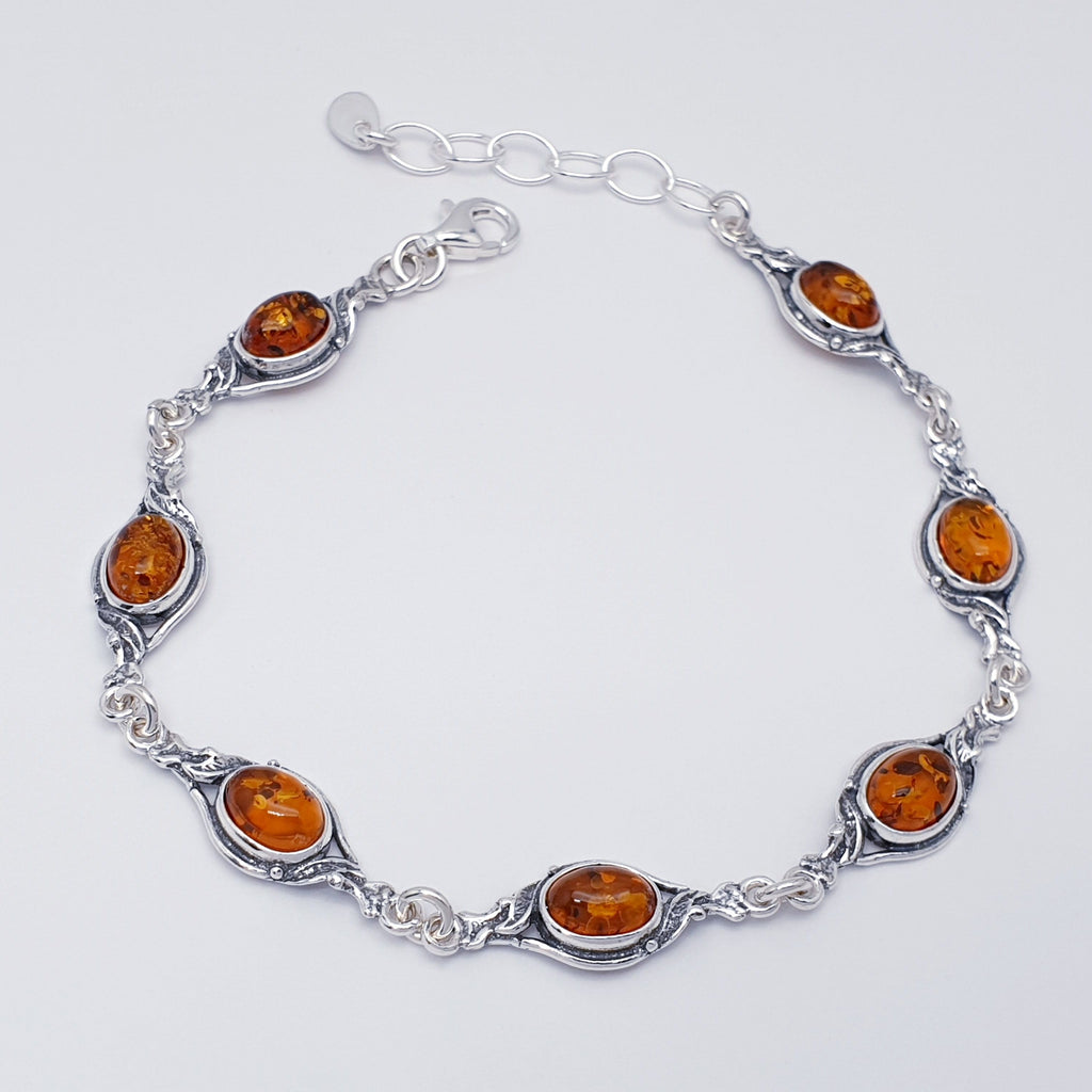 A green genuine amber vintage style bracelet, with sterling silver.