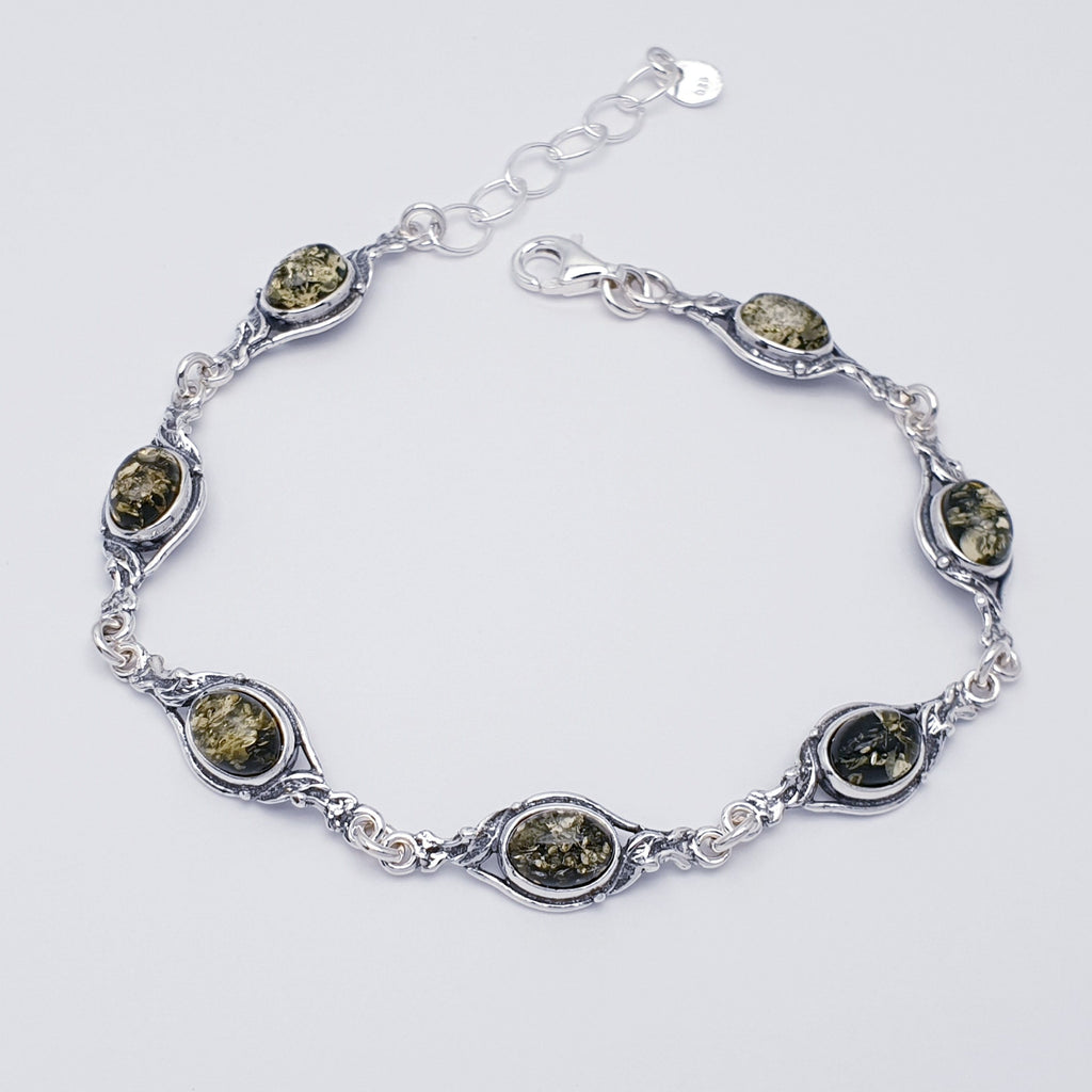 A green genuine amber vintage style bracelet, with sterling silver.