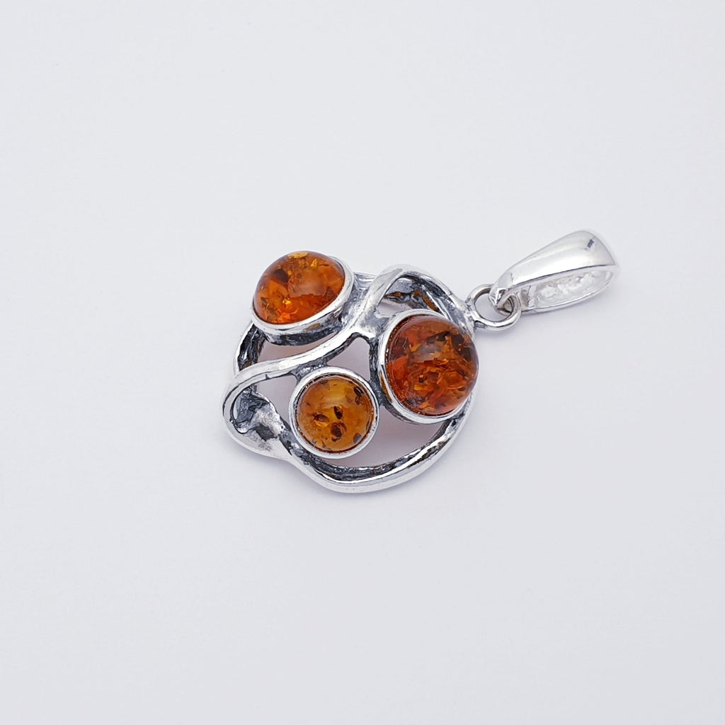 a toffee Amber Sterling Silver pendant side view