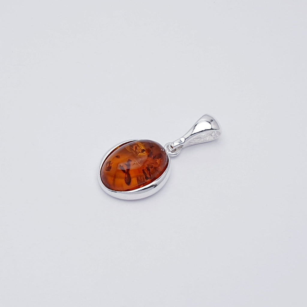 dainty oval vintage style amber pendant 
