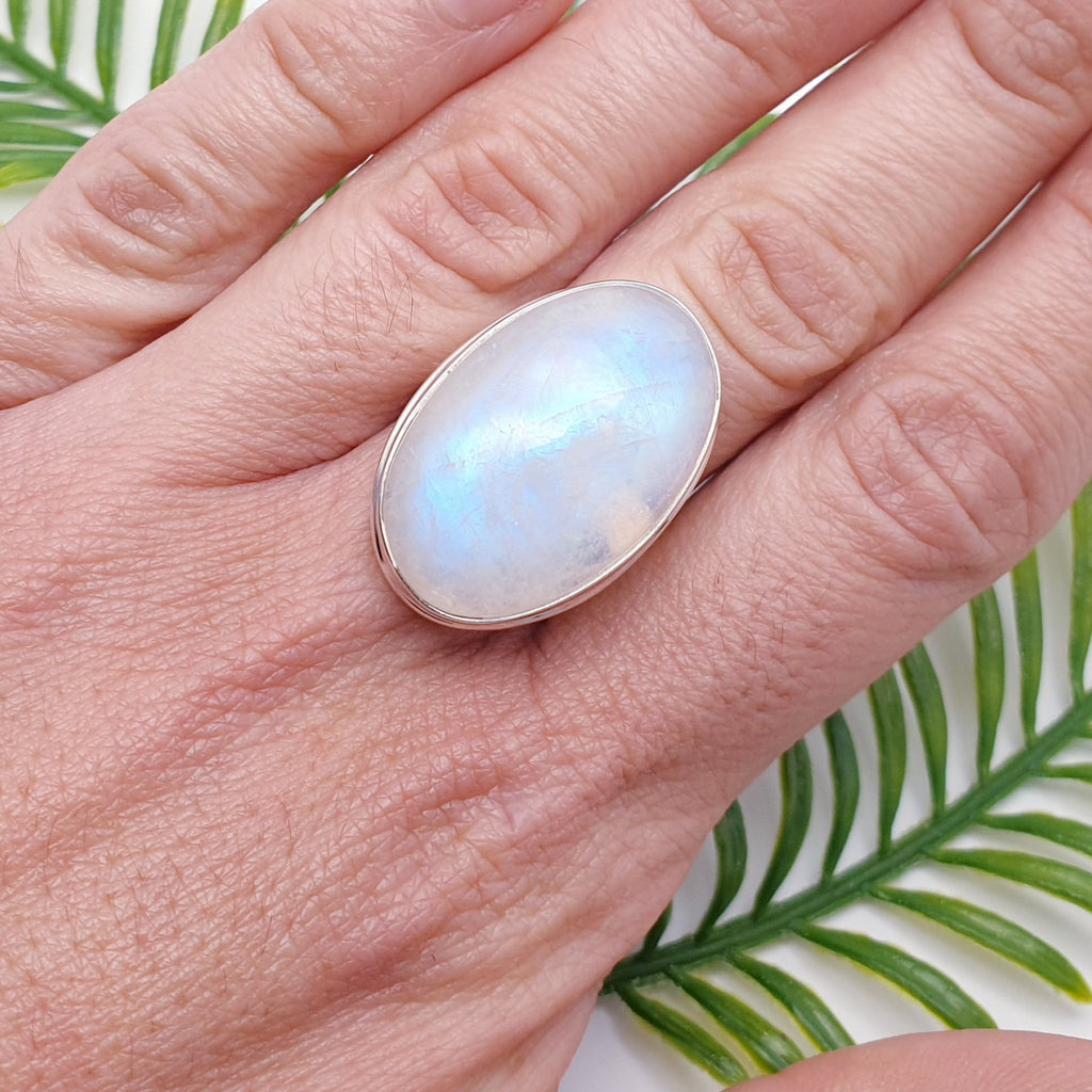 large oval moonstone ring on hand