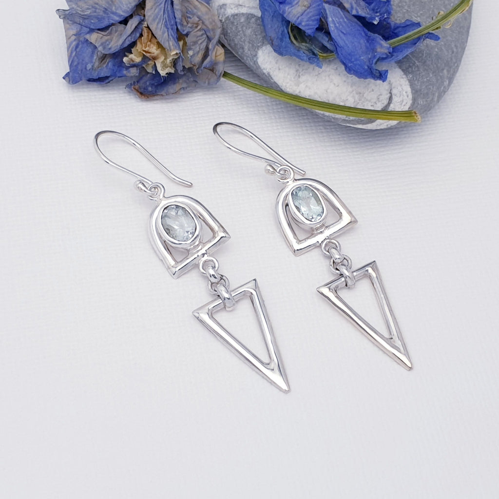 Blue topaz and sterling silver dangly drop triangular shape earrings, with flower foliage