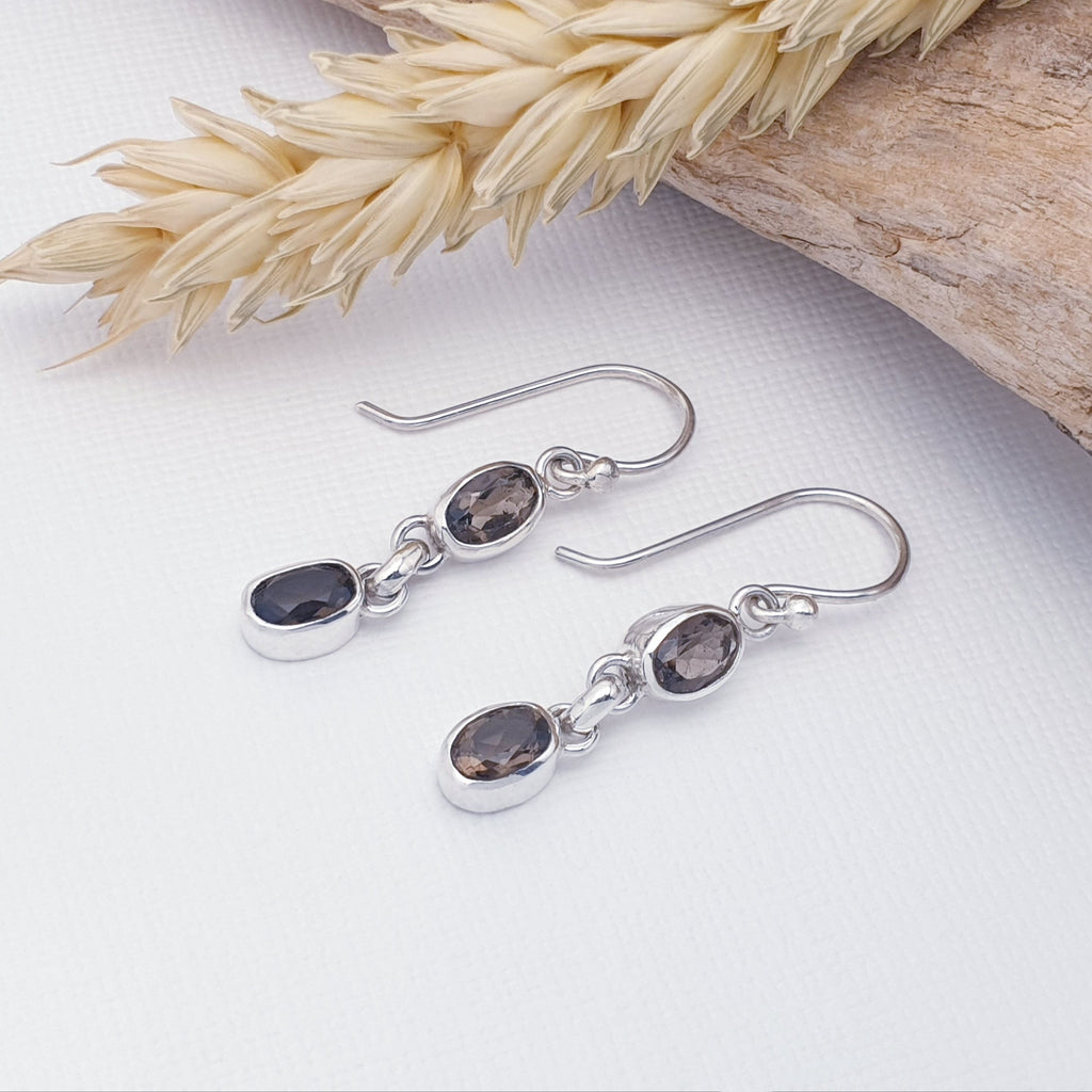 A pair of dainty smoky quartz and sterling silver earrings with driftwood decor.
