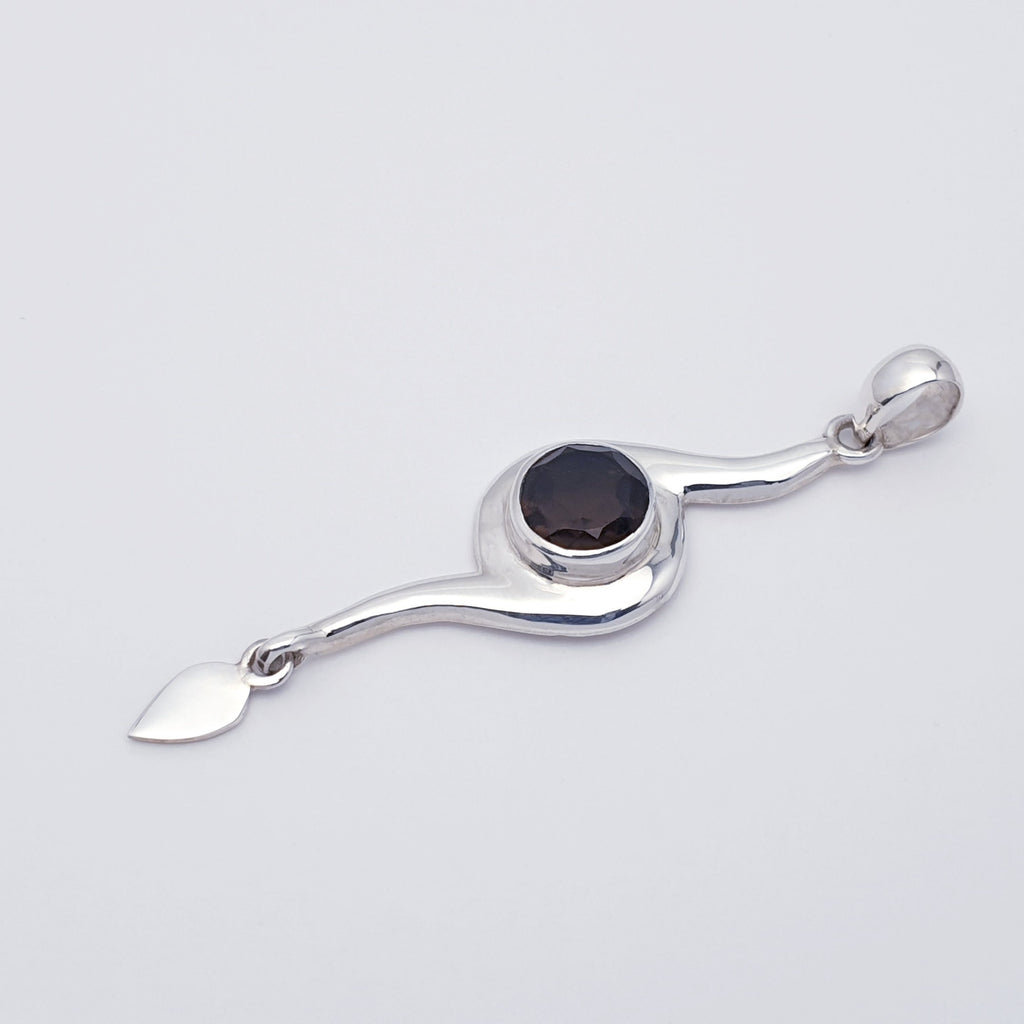 A pendant with a smoky quartz gemstone set in a contemporary style sterling silver design side view