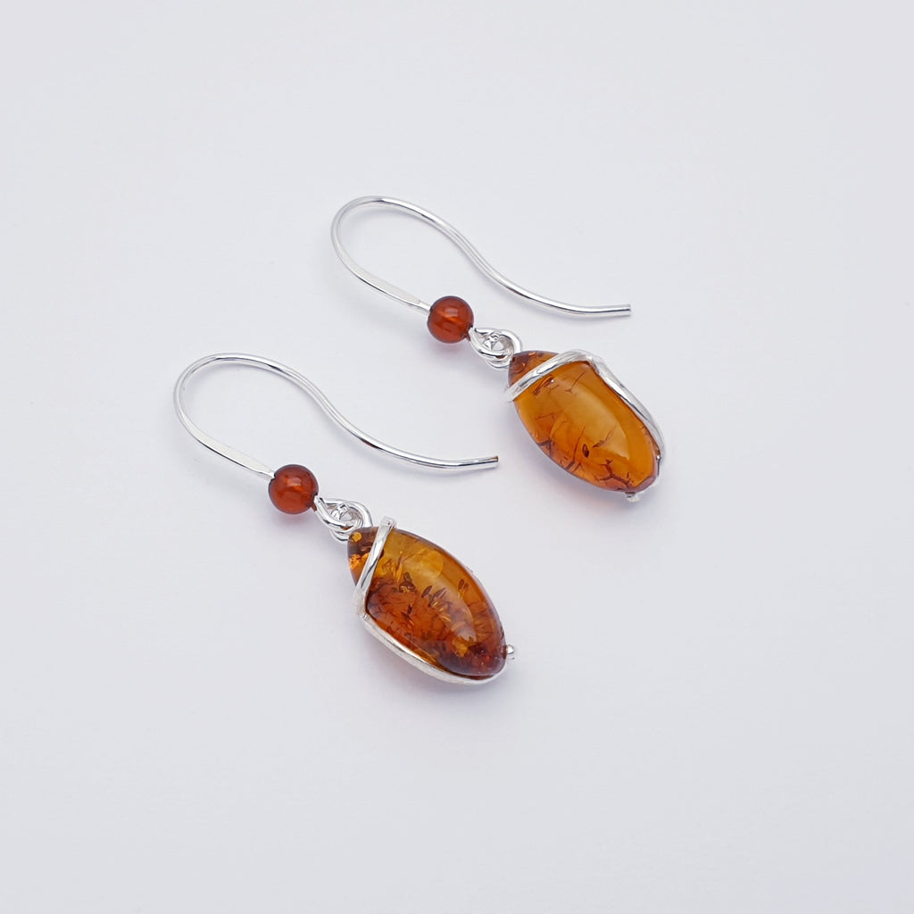 Amber Gisela earrings on a white background