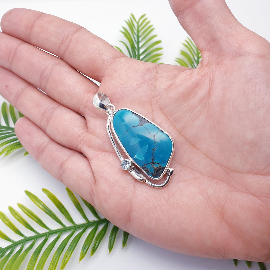 turquoise and blue topaz gemstone pendant with sterling silver botanical design