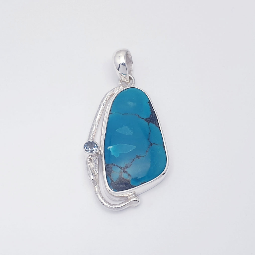 turquoise and blue topaz gemstone pendant with sterling silver botanical design