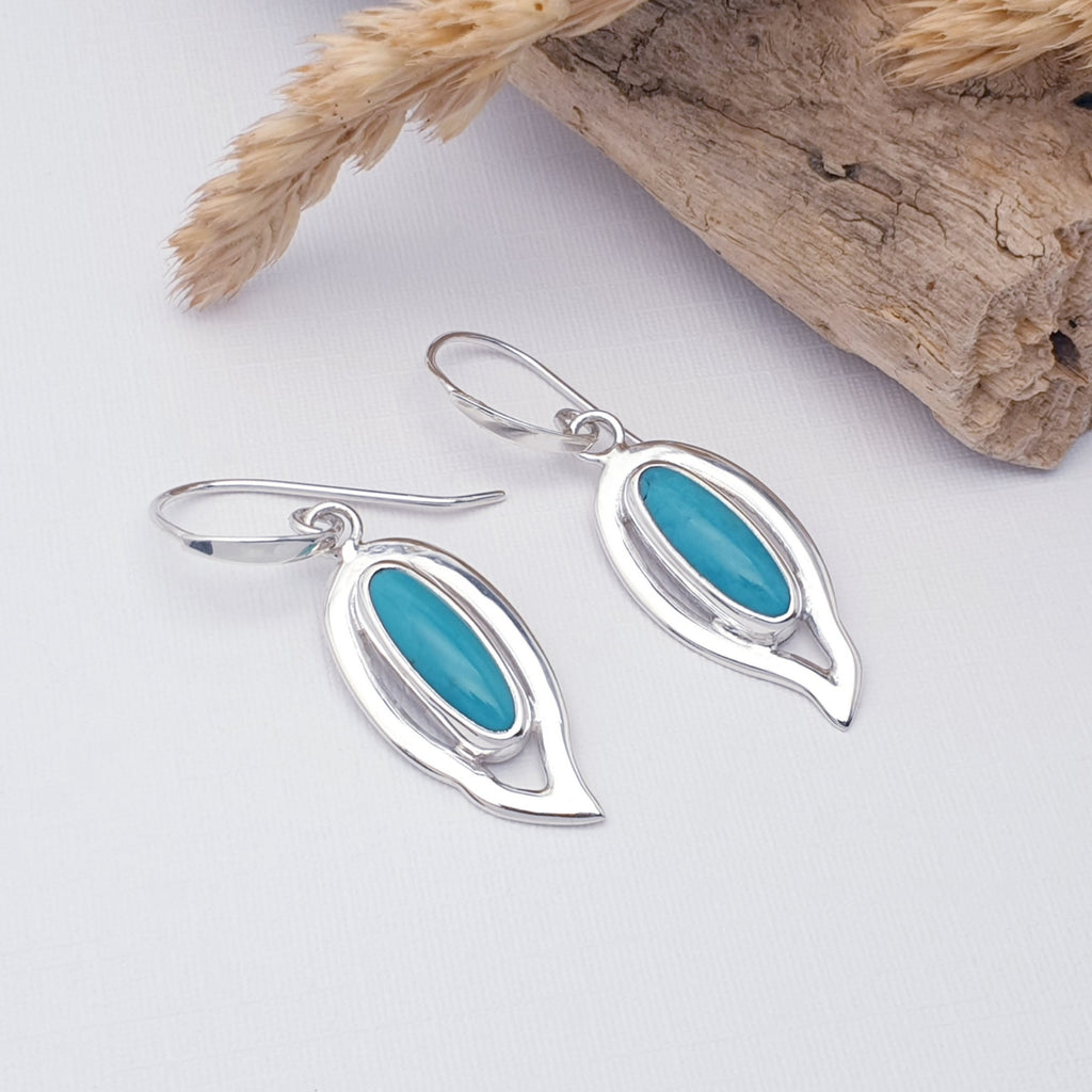 Handmade turquoise gemstone earrings with sterling silver leaf design