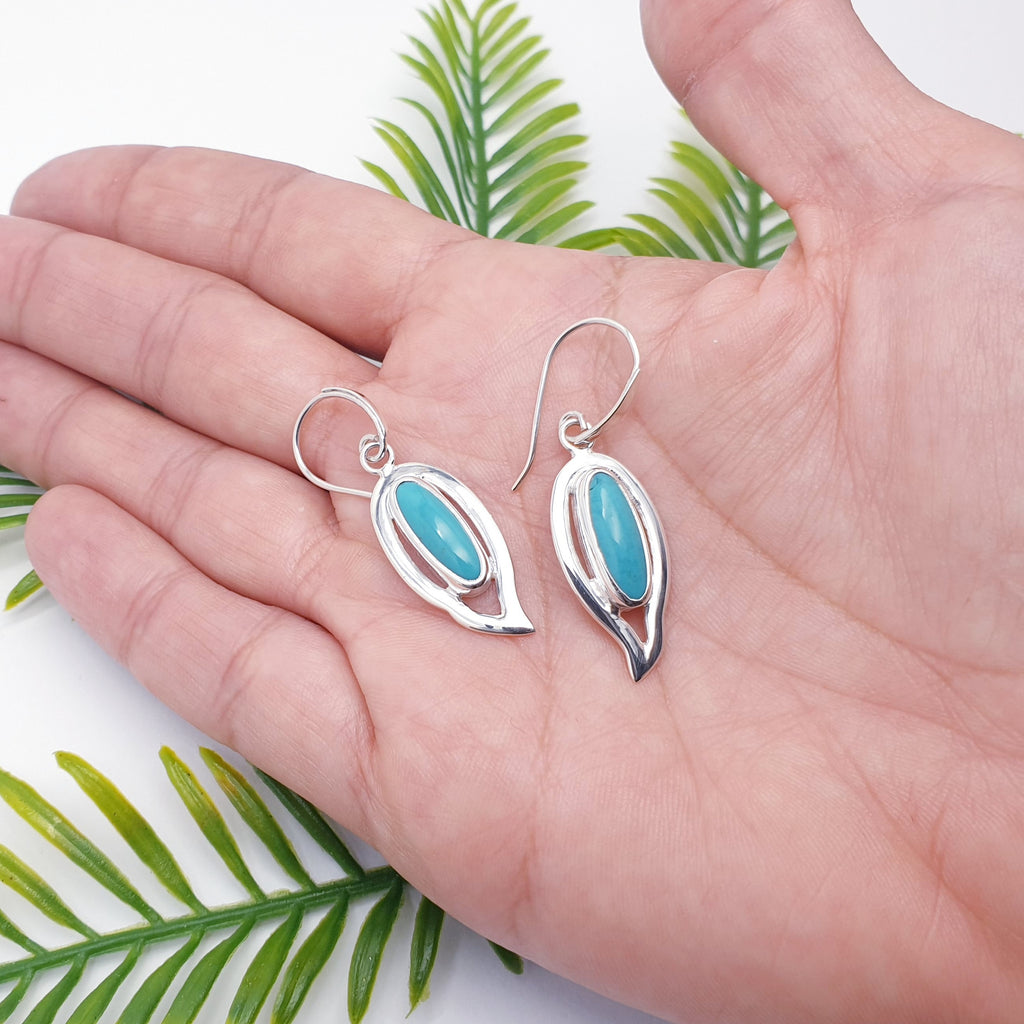 Handmade turquoise gemstone earrings with sterling silver leaf design