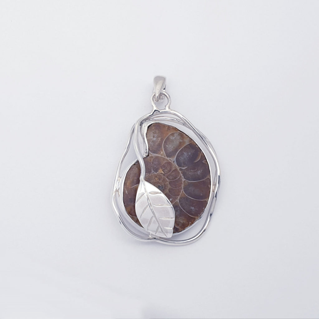 Ammonite fossil pendant with sterling silver leaf design