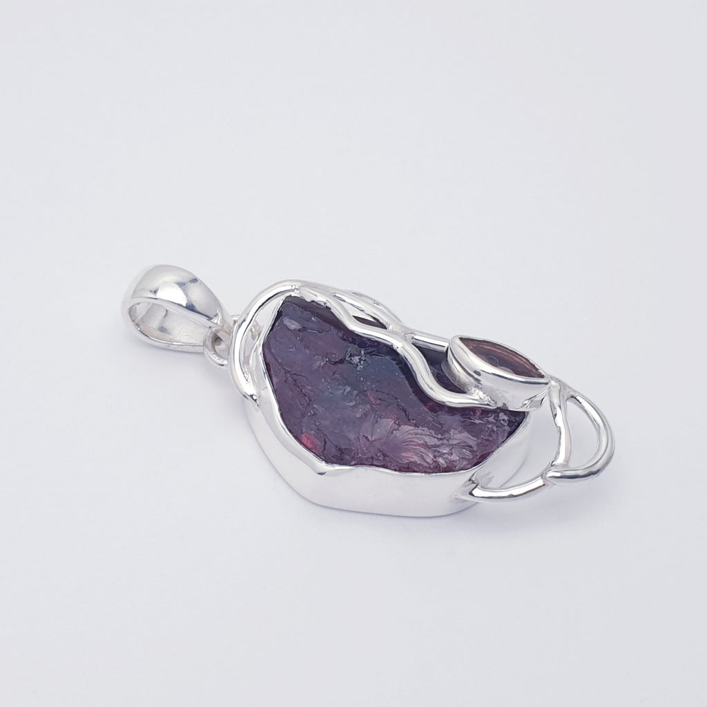 Raw garnet pendant with sterling silver vine design