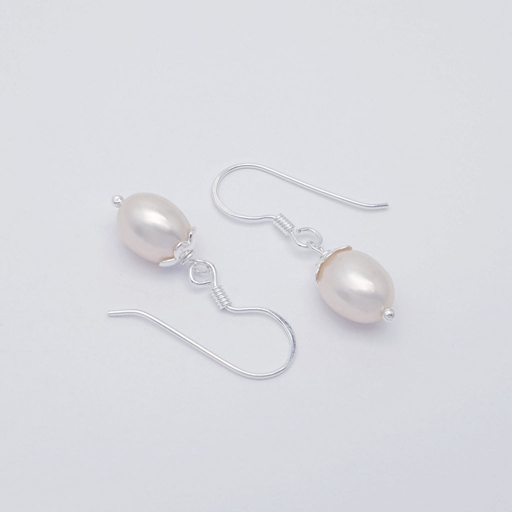 Handmade pearl and sterling silver earrings.