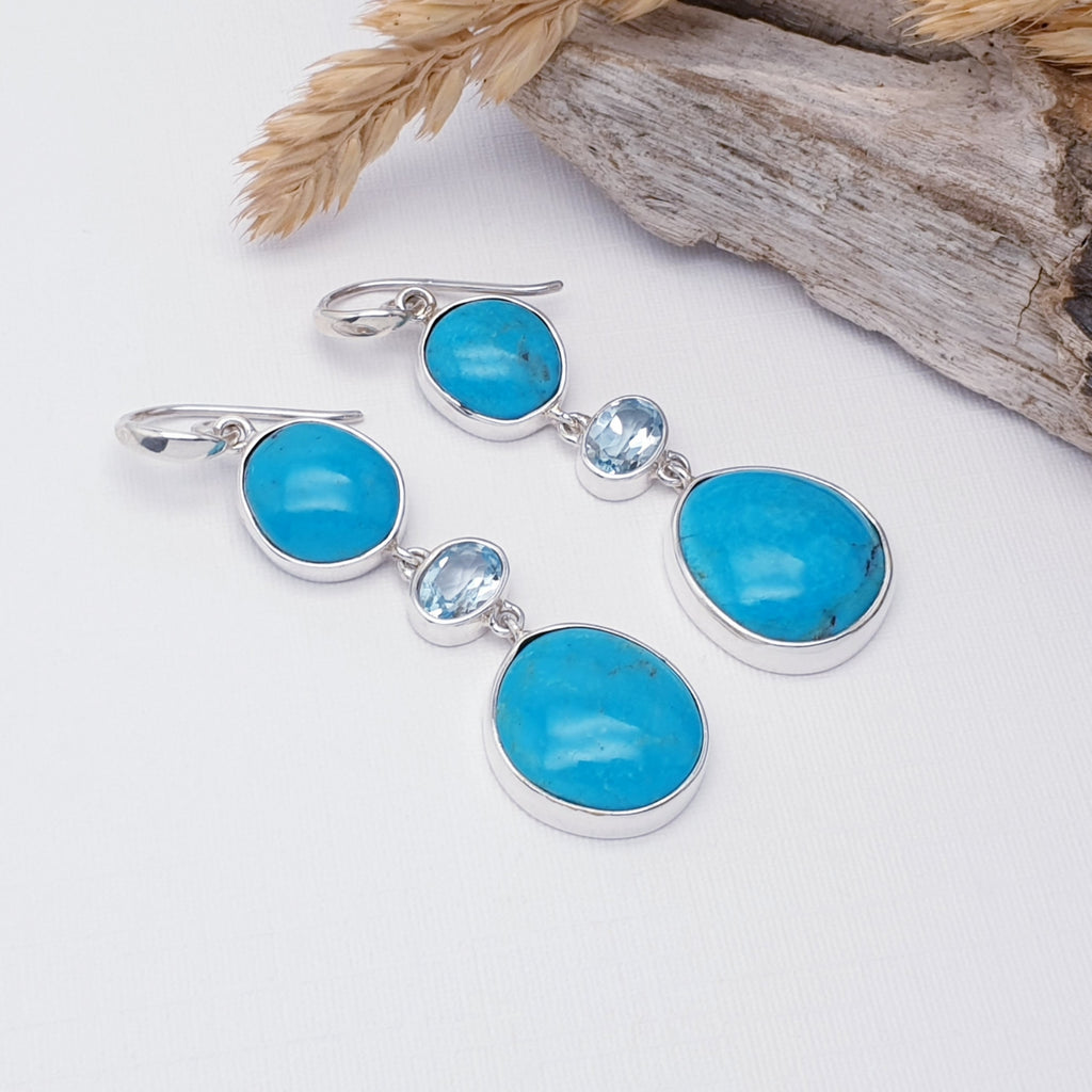 Turquoise and Blue Topaz Free Form Earrings on a white background with bark and barley in the top right corner